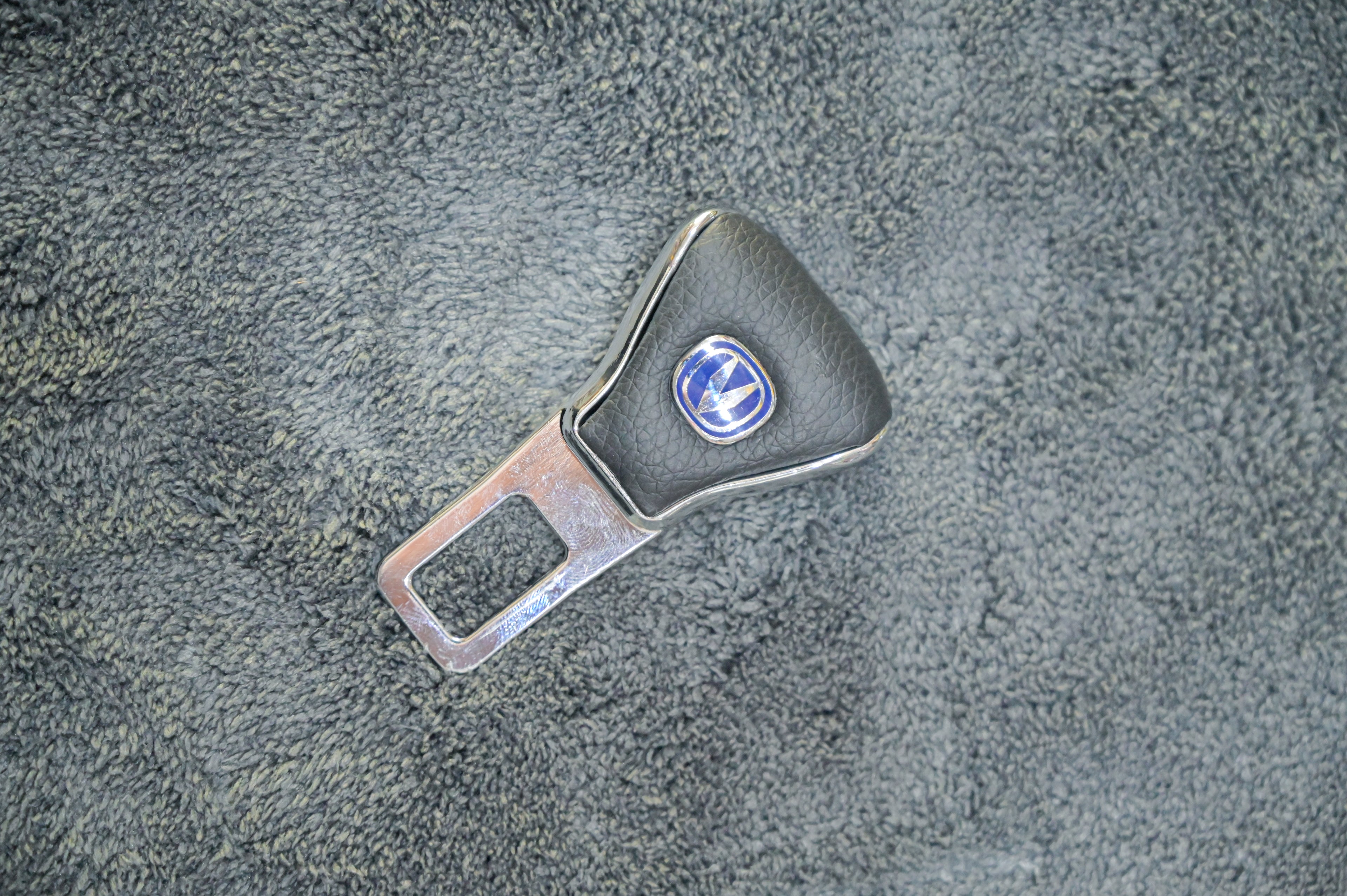 Premium Changan Seat Belt Buckle Extender & Alarm Silencer – Black Leather & Chrome Emblem Clip